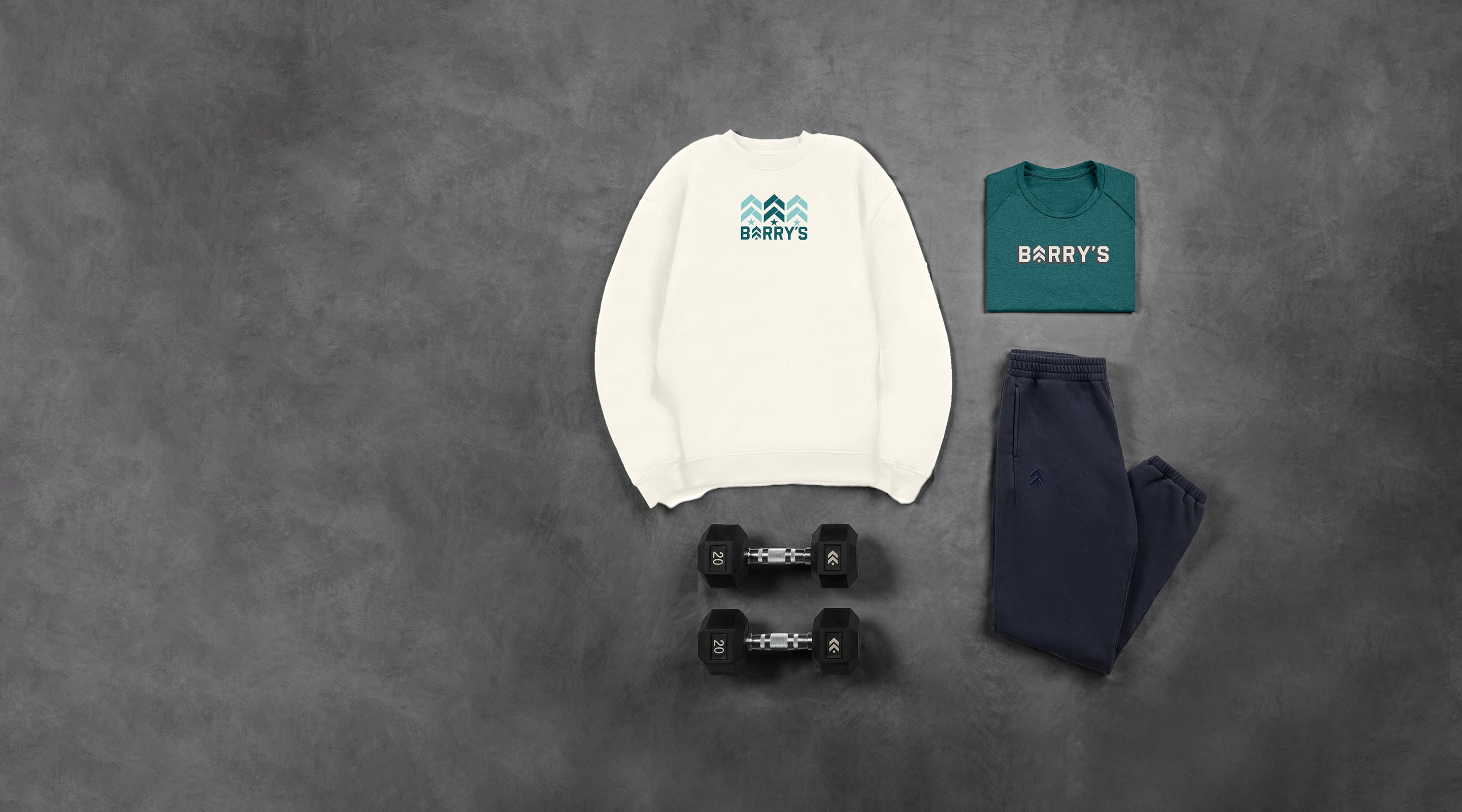 White and green sweatshirt, navy pants, and dumbbells on a gray textured background with 'BARRY'S' branding.