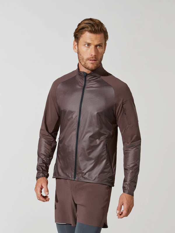front view of male model in shiny mauve athletic jacket and matching mauve shorts